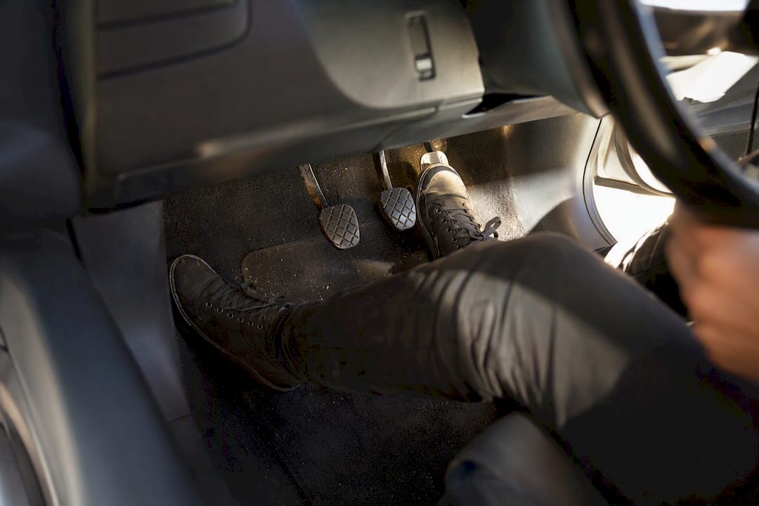 Welcome to Connect Driving School 21 Close-up of learner’s feet on car pedals