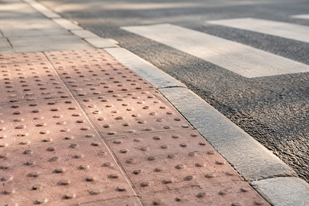 Tactile blister paving at UK dropped kerb